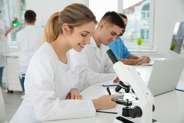 Fototapeta premium Medical students working in modern scientific laboratory