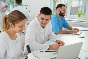 Fototapeta premium Medical students working in modern scientific laboratory