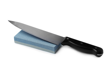 Sharp chief's knife and grindstone isolated on white