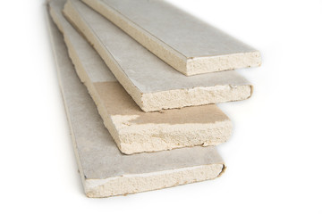 Stacking of white gypsum panels, drywall or plasterboard