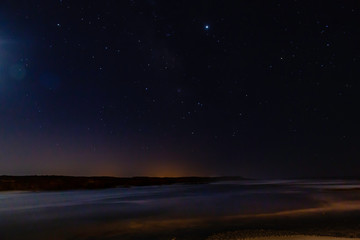 Fototapeta na wymiar Night photography of the shore at Vila Nova de Milfontes, Portugal