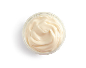 Delicious mayonnaise sauce in bowl on white background, top view