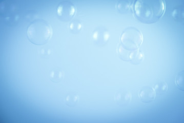 Beautiful abstract close up color white and blue soap bubbles background and wallpaper