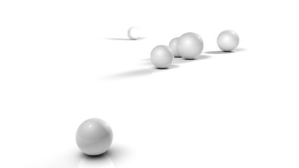 3D illustration of white balls on white reflective background. Balls of different sizes are rolled in different directions. Futuristic image for background and desktop 3D rendering with depth of field