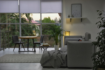 Fototapeta na wymiar Cozy living room with modern furniture and stylish decor. Ideas for interior