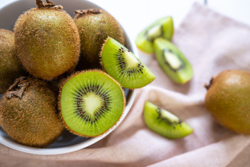 Kiwi fruit on white wooden table, Tropical fruit