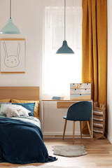 Contemporary bedroom and workspace teenager room with orange curtains