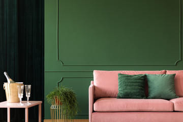 Bottle green wall with decorative wall moldings