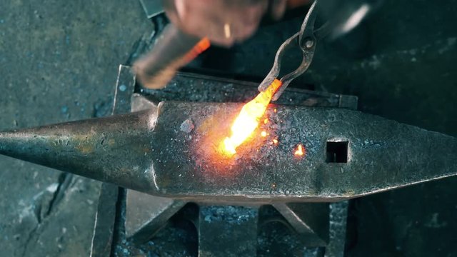 Top view of the anvil and the tool getting hammered