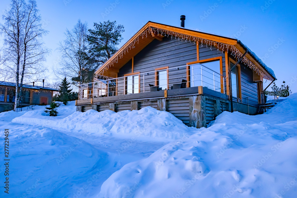 Wall mural winter home in the recreation center. cottage in the snow. christmas holiday villas. country winter 