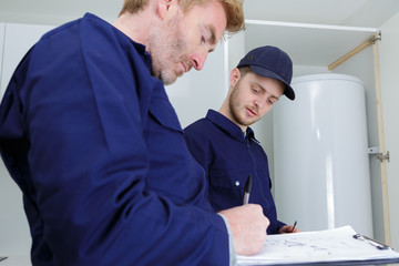 experts checking the quality requirements of boilers