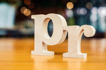 PR Alphabet on Blur Background (Public Relations)