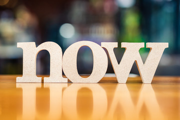 NOW Word on Blur Background