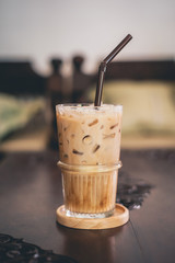 ice coffee in glass on wooden table