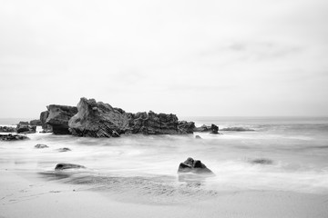 Black and white, long exposure view of beach in, California 
