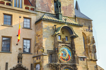 Obraz premium Famous Prague astronomical clock, Orloj, on the Old Town Square of beautiful Czech capital. Popular historical landmark. Golden hour light. Praga, Czechia. Tourist places