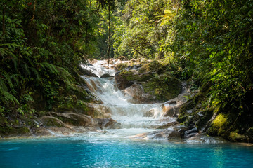 Blue falls of Costa Rica, natural landscape at Bajos del Toro close to the Catarata del Toro and...