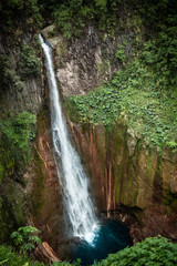 Fototapeta na wymiar Catarata del Toro, waterfall in Costa Rica in the province of Alajuela, close to San Jose. Smooth waterfall image with ND filter and slow shutter speed. 