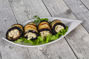 Stuffed eggplant roll with cheese and herbs