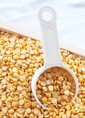 Yellow Dried Soybeans in A Measuring Spoon