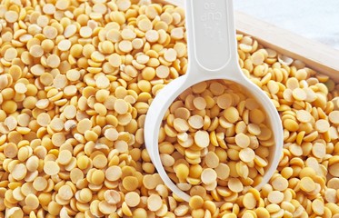 Yellow Dried Soybeans in A Measuring Spoon
