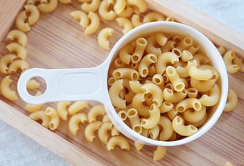 Dried Elbow Macaroni in A Measuring Cup