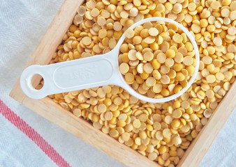 Yellow Dried Soybeans in A Measuring Spoon