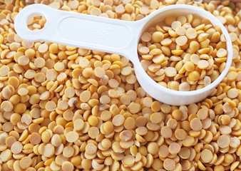 Yellow Dried Soybeans in A Measuring Spoon