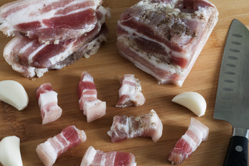 salted lard with pepper and garlic close-up, sliced fat,
