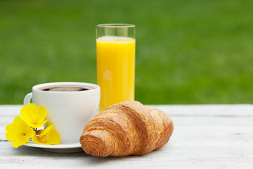 Coffee, orange juice and croissant