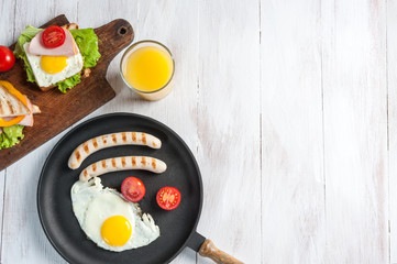Delicious breakfast with eggs, juise and croissant