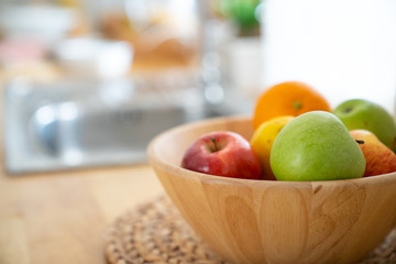 Fresh fruits in a basket wooden at the kitchen