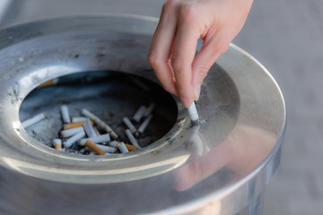 Cigarette butts in the urn, close-up.