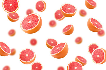 Falling grapefruits isolated on white background, selective focus