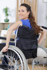 woman in a wheelchair at home