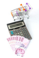 Turkish 200 banknotes with calculator and shopping basket background. - 277239237