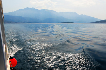 Sea and mountains in the evening light. Tourism on the Adriatic by ship