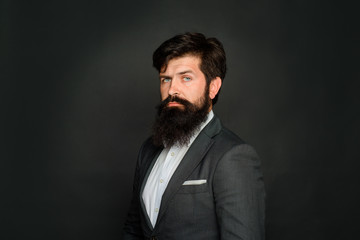 Obraz premium Thoughtful handsome male. Attractive bearded man in suit. Concentrated bearded man thinking about something. Successful businessman. Bearded man portrait. Handsome stylish man. Bearded male portrait.