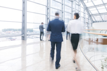 Business people walking in hall