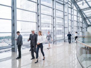 Business people walking in hall