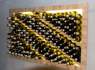 Cellar, wine cellar. Niche with bottles of wine. Red and white wine, wine storage
