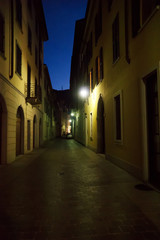 Illuminated lonely street at night.