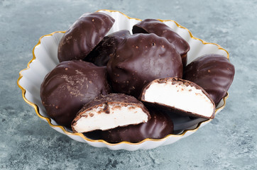 Homemade sweet  marshmallows in chocolate, ready to eat.