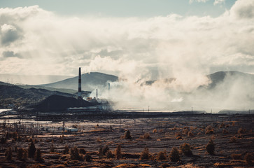 pollution of the environment by factory toxic smoke from the chimneys the dead ground nearby. toxic...