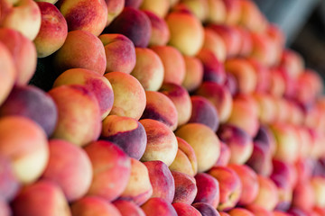 Box of Peaches on a Peach Fruit Stand at A Farrmer's Market Orchard in the Summer