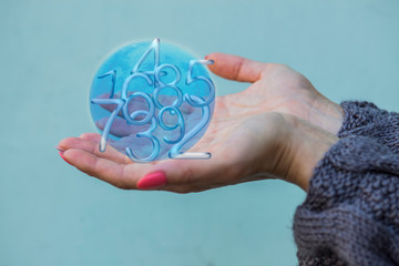 Figures and numbers in hands in the moon