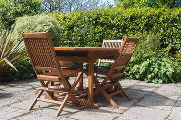 Obraz premium Terrace and wooden garden furniture during spring