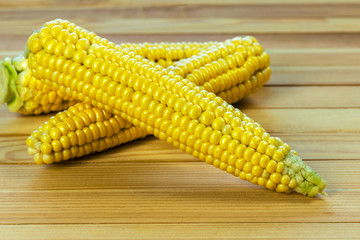 sweet corn on wooden table