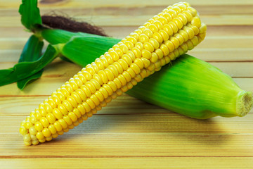 sweet corn on wooden table