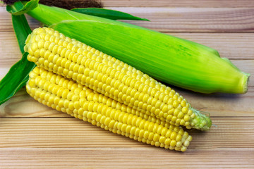 sweet corn on wooden table